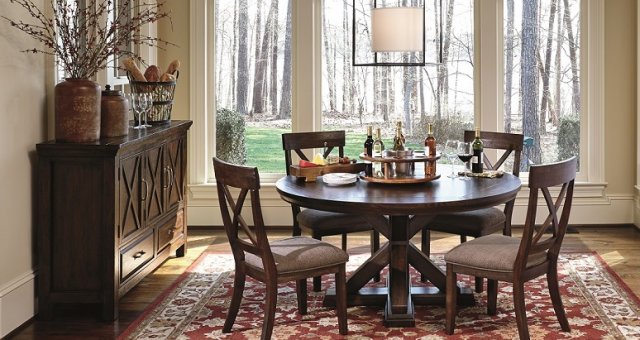 warm dining room table set with three cabinet buffet