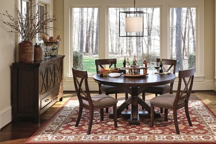 warm dining room table set with three cabinet buffet