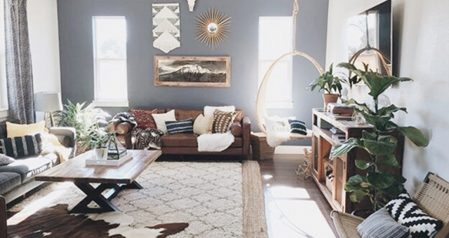 large living room with layered rugs to complete a boho look.