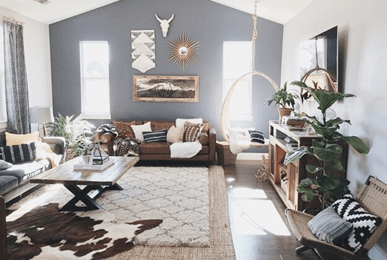 large living room with layered rugs to complete a boho look.