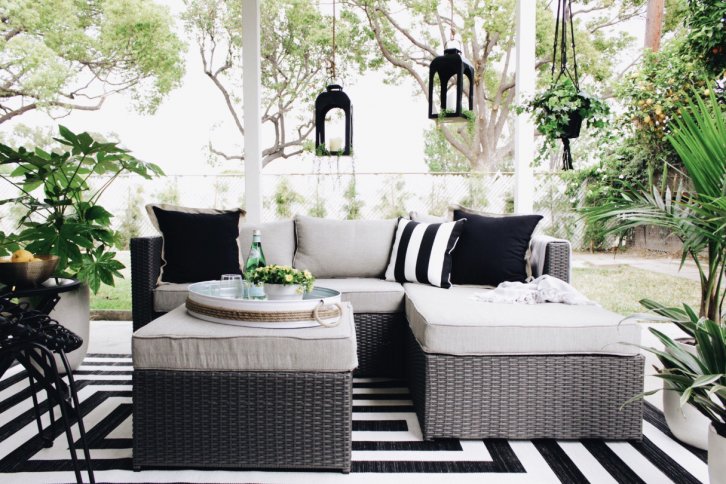 gray patio set with black pillows