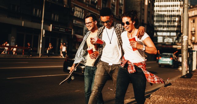 friends walking down sidewalk