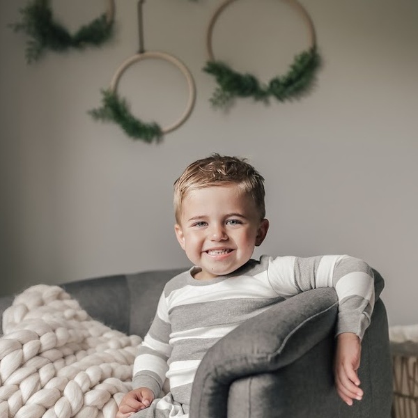 Child smiling in room.